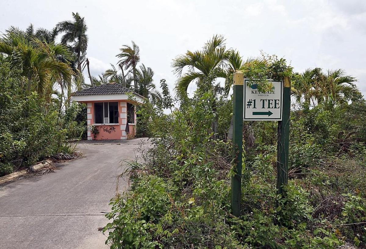The sign leading to the first tee at Keys Gate Golf Course.