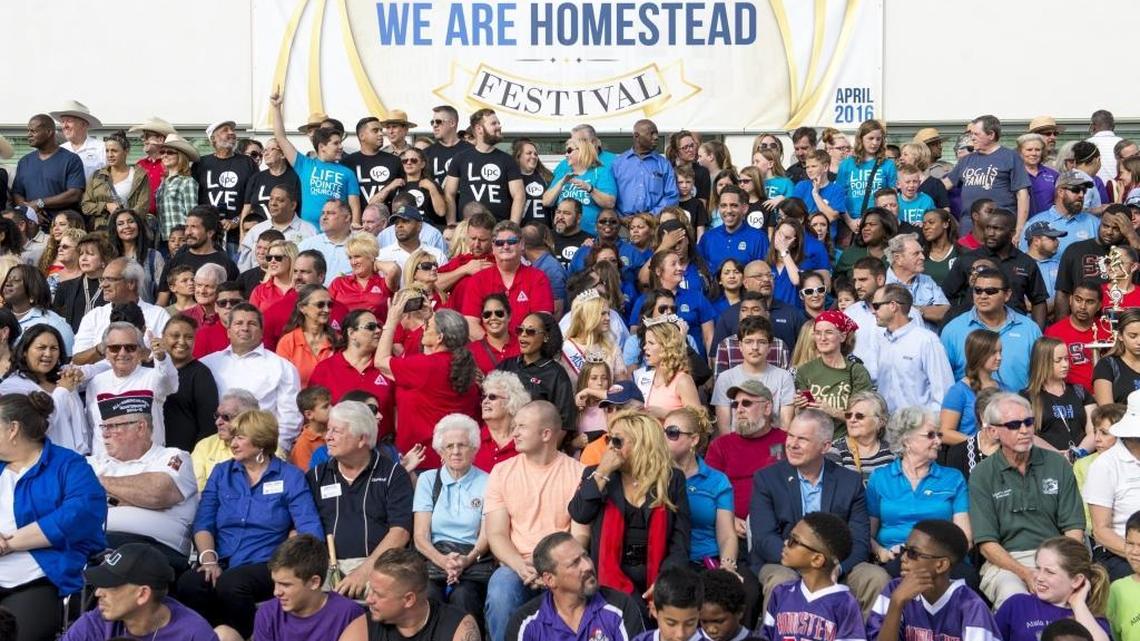 A crowd of community members gathered for a photo at the opening of Homestead’s new city hall on Monday.