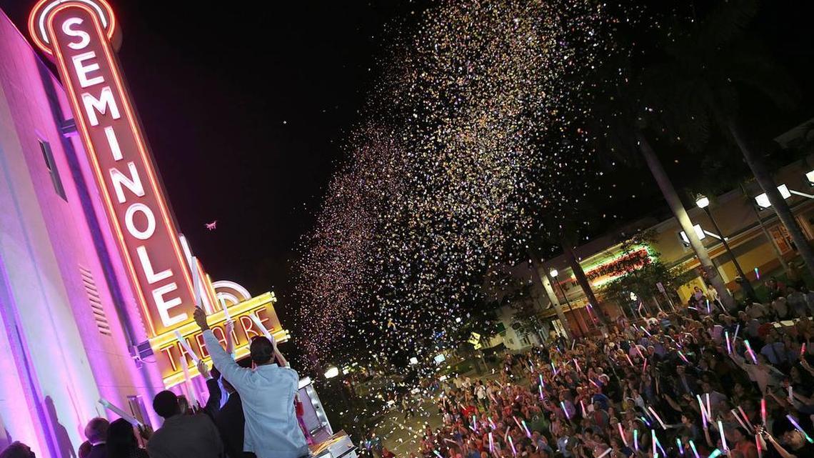 Homestead residents celebrate the reopening of the historic Seminole Theatre with a marquee lighting. The historic theater opened to the public for the first time in nearly 40 years on Wednesday, Oct. 28, 2015.