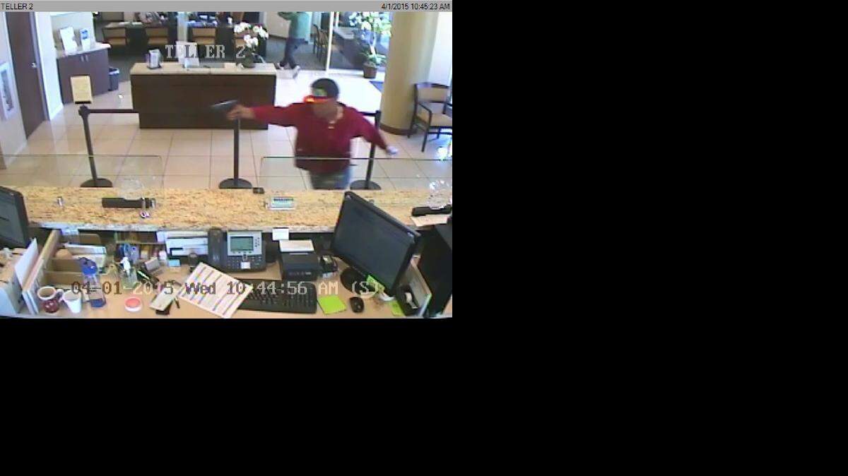 
The FBI released photos of three suspects captured on camera during an armed robbery that took place around 10:45 a.m. on Wednesday to the TotalBank branch on 8311 SW 40 St. One of the suspects was wearing a red hoodie.
