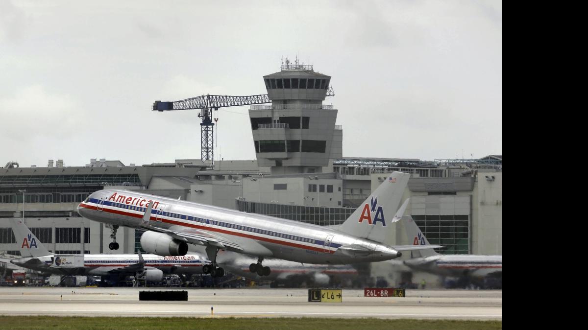 
An America Ailines passenger plane takes off at Miami International Airport in this 2013 file photo. 
