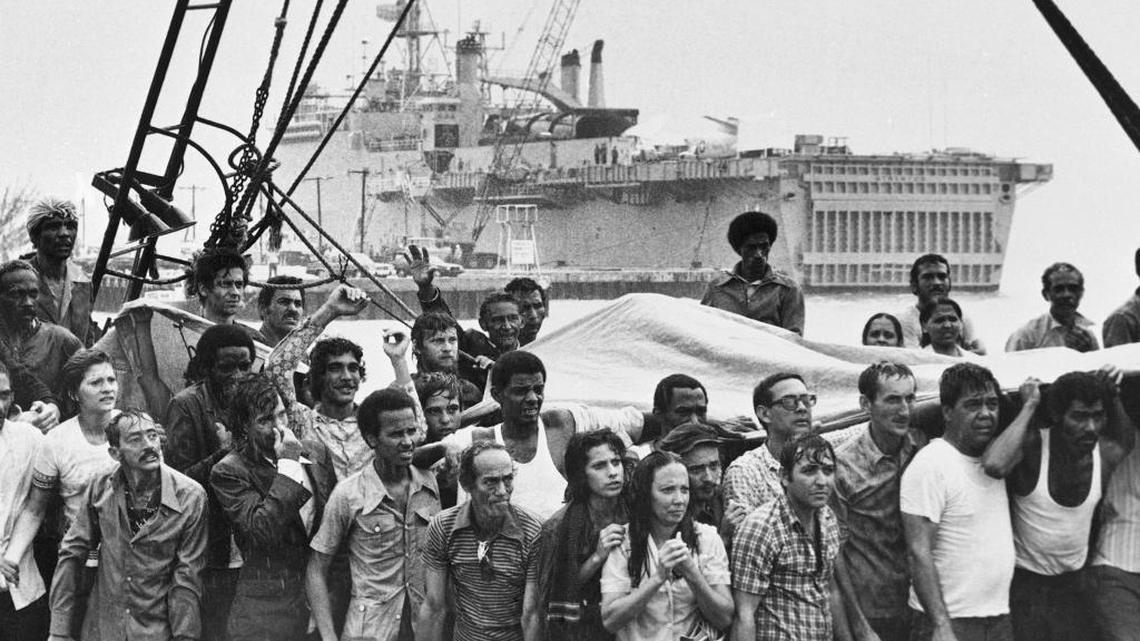 In this May 1980 file photo, refugees from Cuba stand on the deck of their boat as they arrive in Key West. In the Mariel boatlift, more than 100,000 Cubans fled the island by sea in the space of just six months.