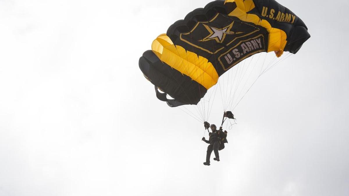 The U.S. Army Golden Knights parachute team performs at the Air and Sea Show Media Event at the Coast Guard Air Station Miami at Opa-locka Executive Airport on Friday, May 26, 2017.