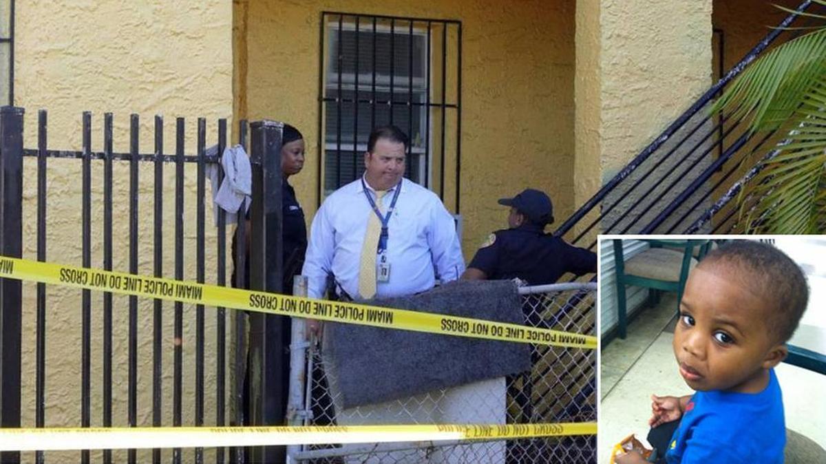 
Miami crime scene officers and detectives look over the apartment building at 112 NE 71st St. where a child was shot Tuesday, Aug. 4, 2015.


