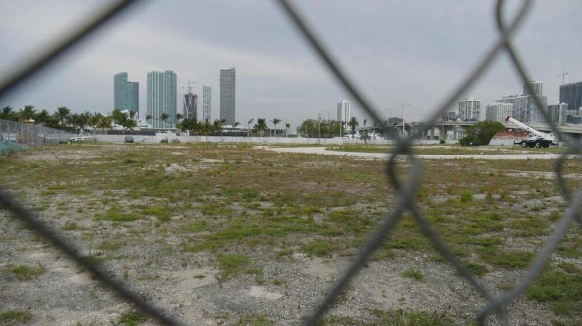 Utility excavation work at Flagstone Island Gardens, the island Shangri-la promised 15 years ago on Watson Island and never delivered, was enough to keep the developer in its lease with the city. A photo taken on May 5, looking west toward downtown Miami, shows the property in its current state.