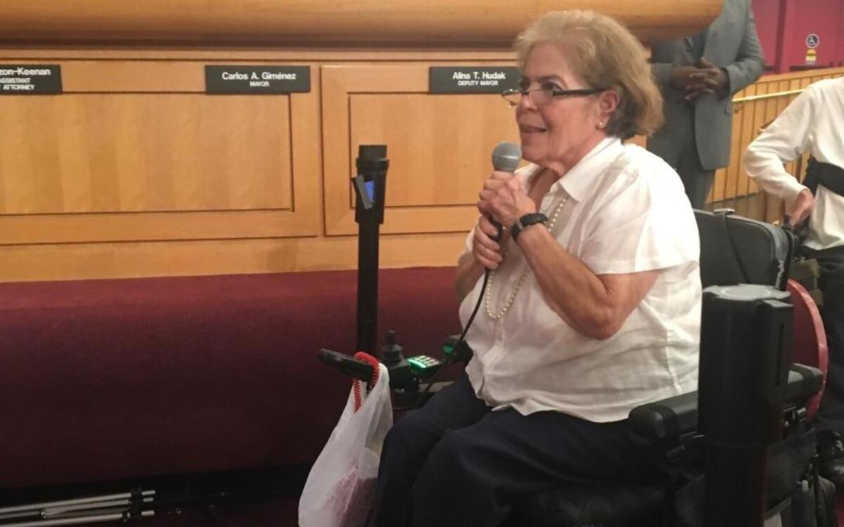 Angelina Rodriguez, president of Spinal Cord Living-Assistance Development, addresses Miami-Dade commissioners before they rejected recommendations for awarding $14 million in charity grants. Rodriguez’s organization was recommended for increased funding but as a result of the commission vote, will get its current grant amount.