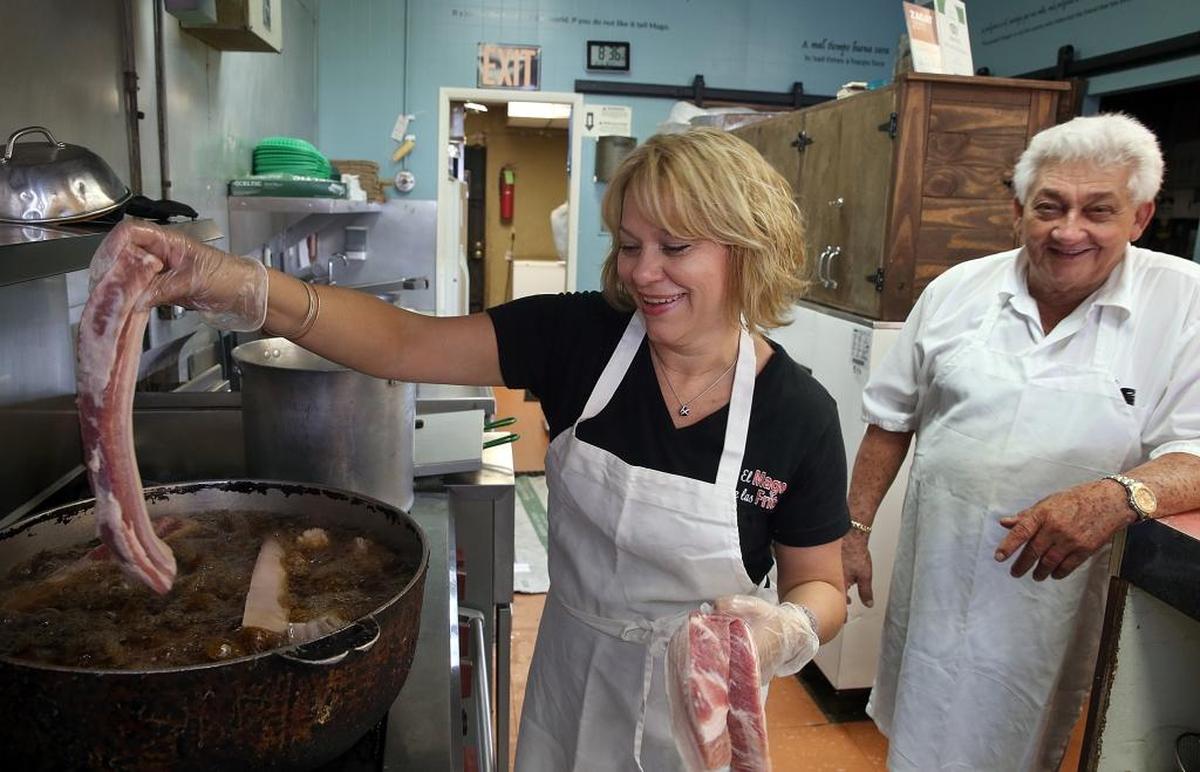 Martha Cardenas helps run her father Ortelio’s business, El Mago de las Fritas, which has been in West Miami for 35 years.