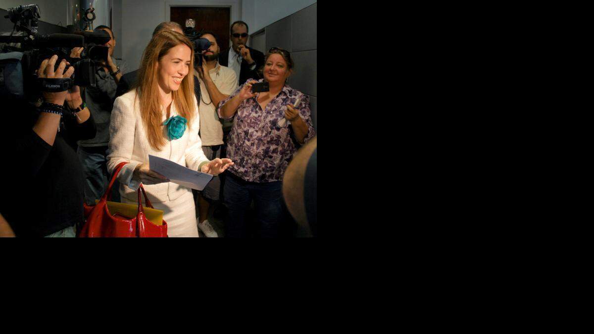 
School Board member Raquel Regalado walks out of the Miami-Dade Elections Department on Monday, March 9, after filing her candidacy papers to run for county mayor.

