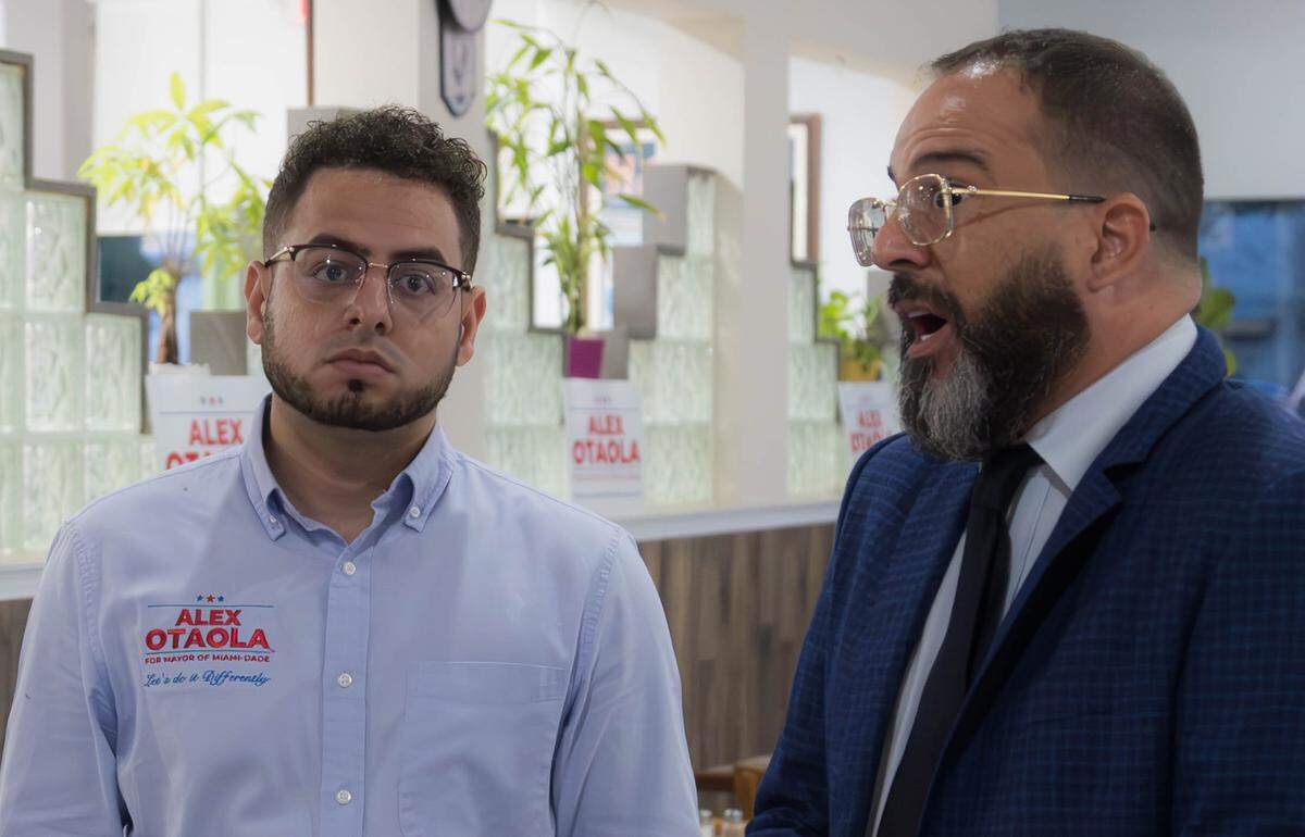 Andy Santana, left, and Alex Otaola, a Miami-Dade County mayoral candidate, at an El Tropico campaign event on Wednesday, July 24, 2024, in Doral, Fla. Santana, the campaign manager of Otaloa during his unsuccessful bid to become Miami-Dade mayor, was arrested Thursday in his Hialeah home and charged with single counts of having sex with a minor and contributing to the delinquency of a minor.