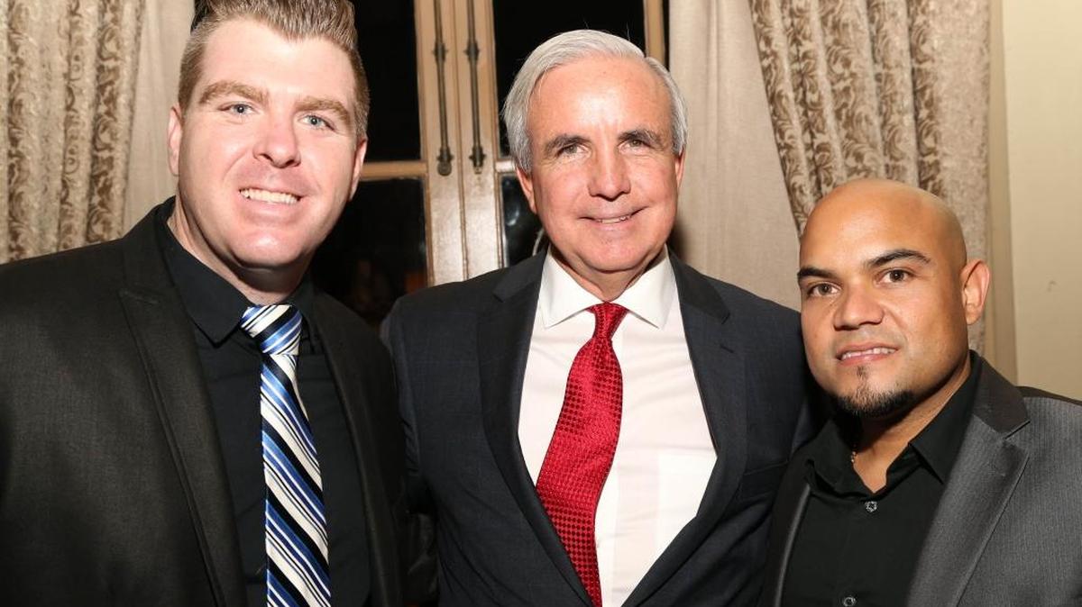 Kyle Post [left], Mayor Carlos A. Gimenez, Louis Fonseca
