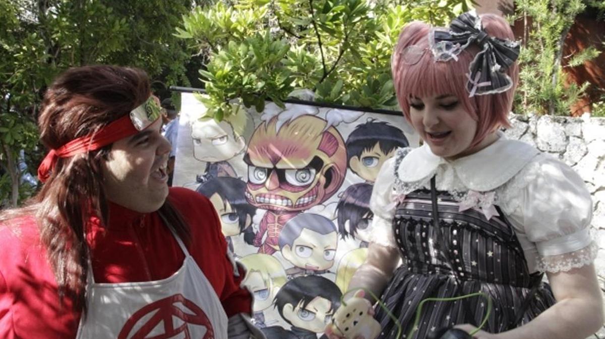 Cosplayers Jonathan Diaz and Tina Schweitzer share a moment at the Ichimura Miami Japan Garden Winter Festival, located at Watson Island.