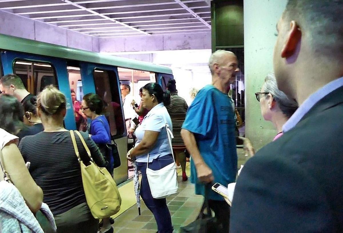 Commuters scramble to hop on the Metromover at Government Center in downtown Miami on Oct. 12, 2017