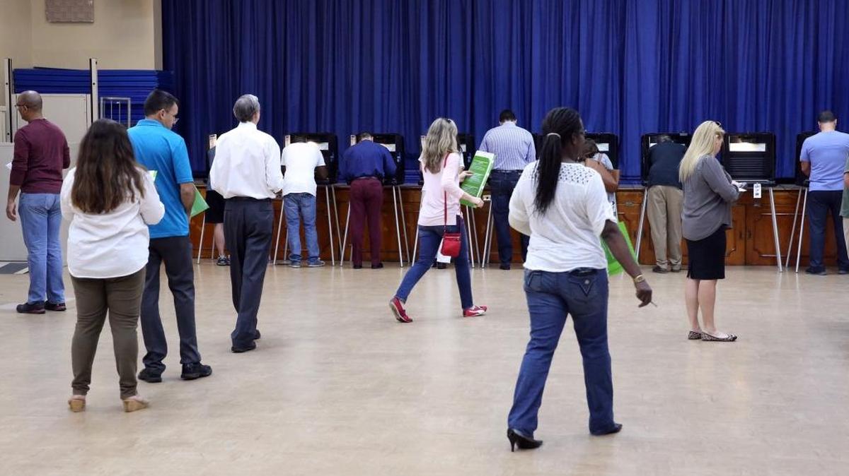 Voters fill their ballots inside the C. Lawton McCall Community Center on election day.