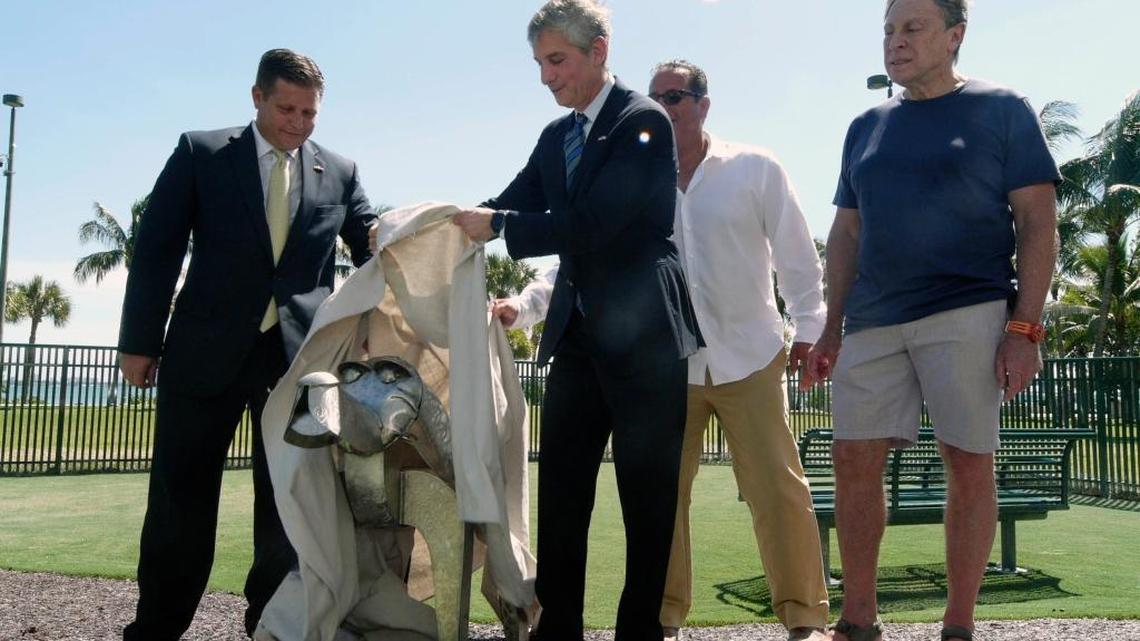 Marc Sarnoff, then a Miami city commissioner and chairman of the Omni Community Redevelopment Agency, unveils a dog statue in October 2015 at a new Miami dog park funded by the special taxing district, which is aimed at reducing slum and blight.