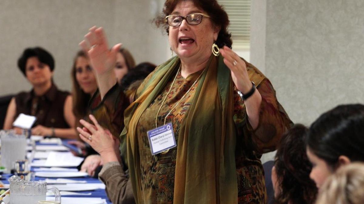 Rabbi Cheryl Weiner gives an orientation to the Seder as two generations of local residents decry the evils of modern-day slavery, as the Greater Miami Jewish Federation’s uman Trafficking Task Force presented its third annual Advocacy Seder on Wednesday