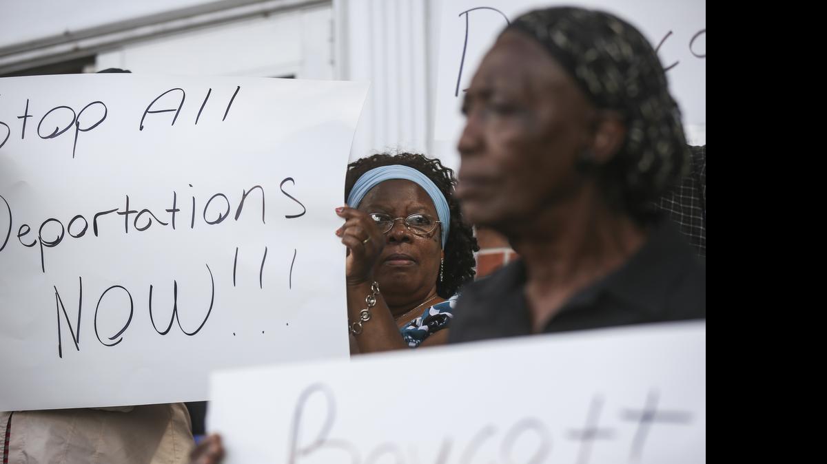 
Protesters rally on the steps of Fanm Ayisyen Nan Miyami (Haitian Women of Miami) to voice their opposition to the mass deportation of Haitians and Haitian-Dominicans from the Dominican Repubic on Thursday, June 18, 2015.
