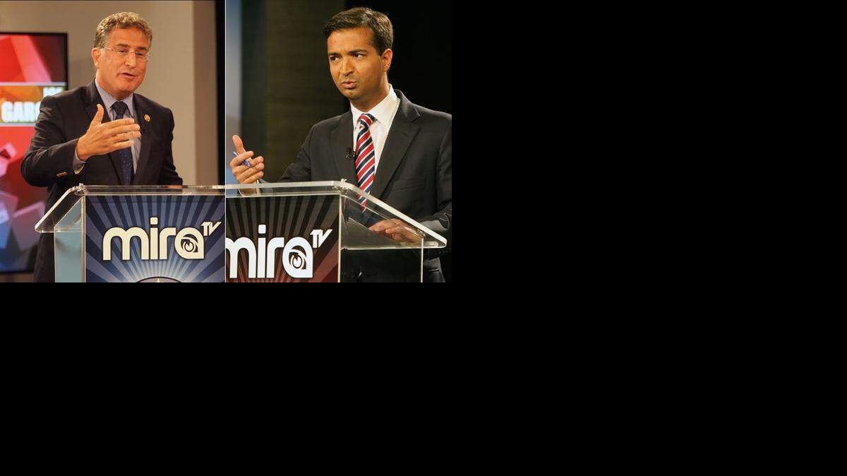 
Rep. Joe Garcia, left, debated challenger Carlos Curbelo, right, on Spanish-language television last week.
