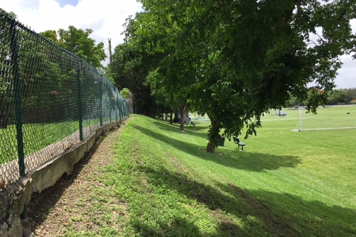 Fencing surrounds the perimeter of South Miami Park, making it difficult to get in. There’s only one entrance, at the southeast corner.