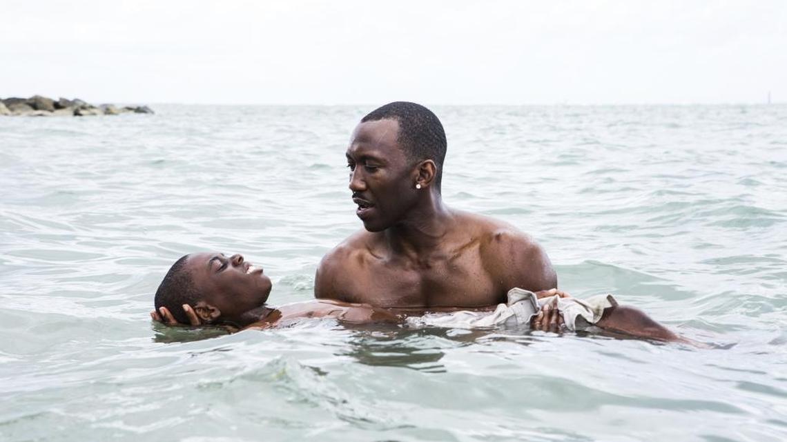 Alex Hibbert, foreground, and Mahershala Ali in a scene from the film ‘Moonlight,’ partially shot in Miami and Miami Beach.