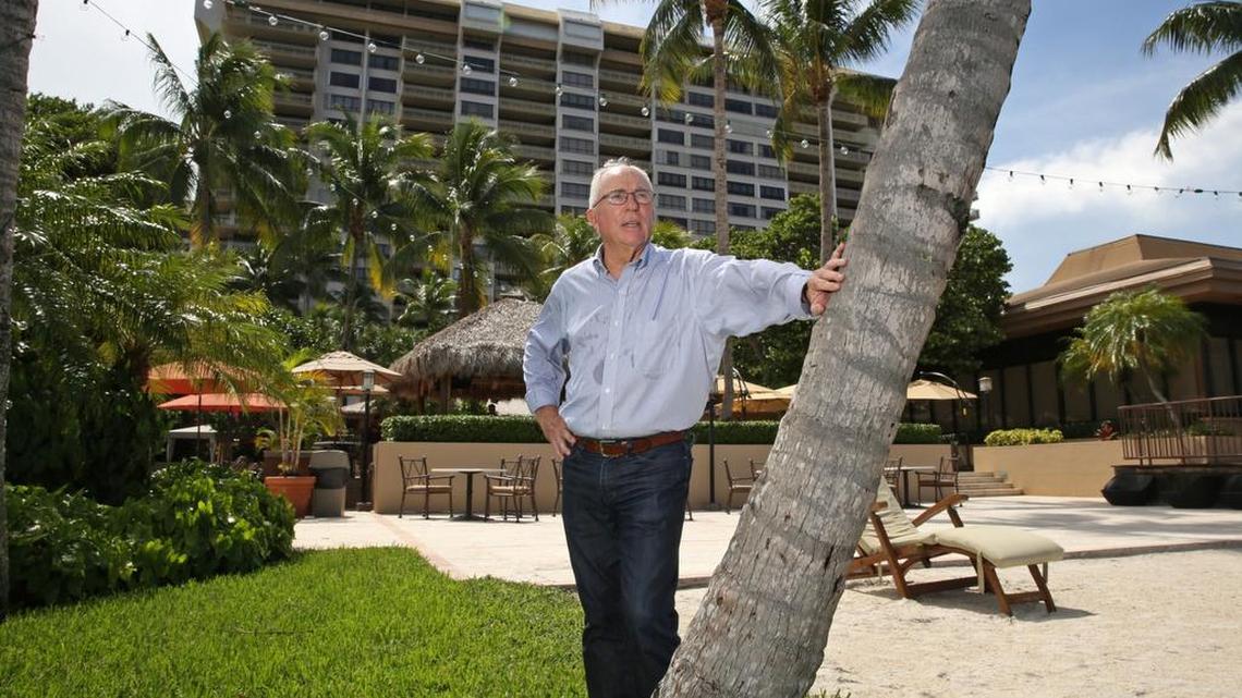 
Grove Isle association president Timothy Moore stands on the area that developers want to replace with a new condo development at the Grove Isle condominiums Friday.
