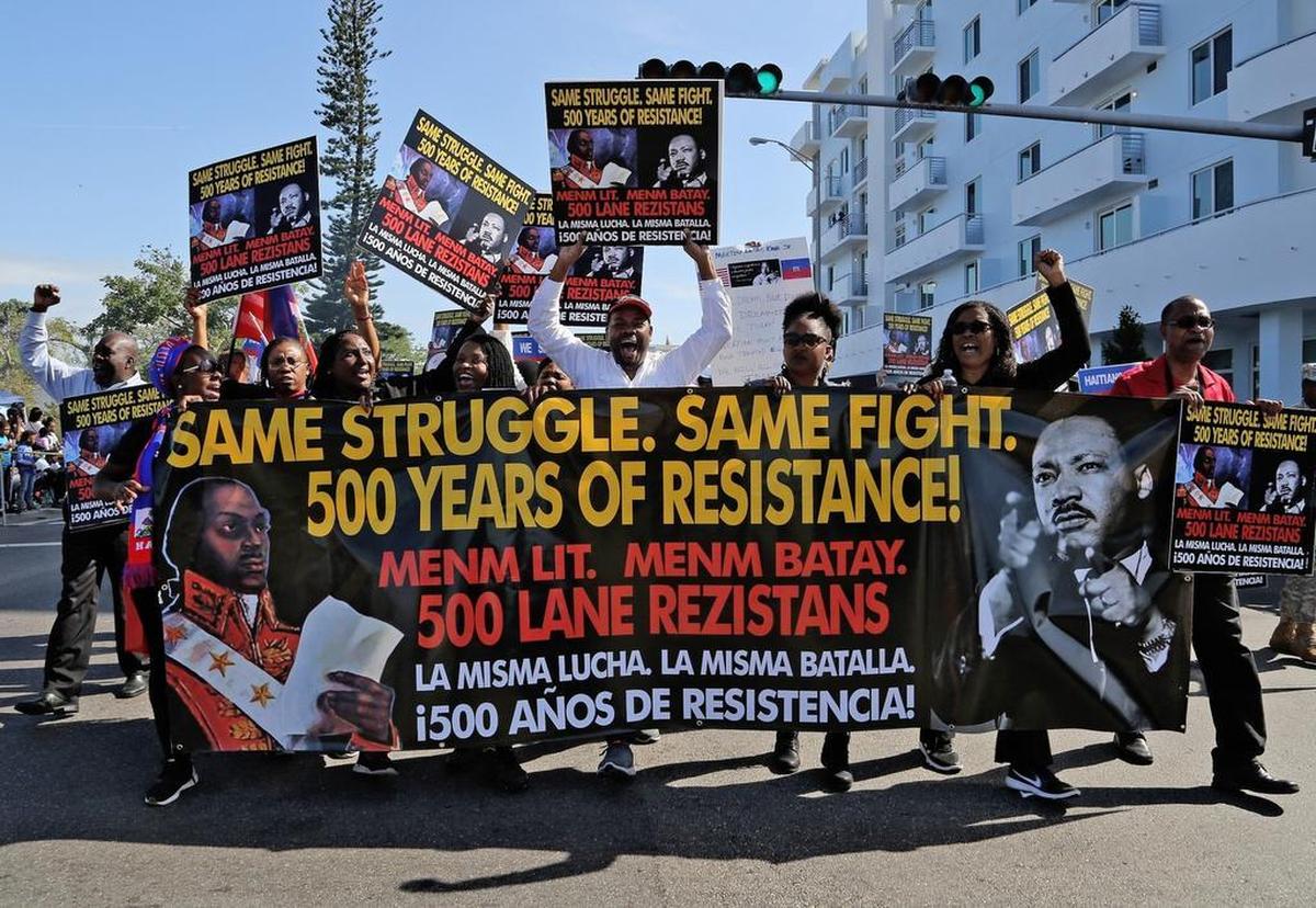Various social justice groups parade in protest against recent statements and policies by the Trump administration during the 41st Annual Martin Luther King Jr. Day Parade in Liberty City in Miami on Monday, Jan. 15, 2018.