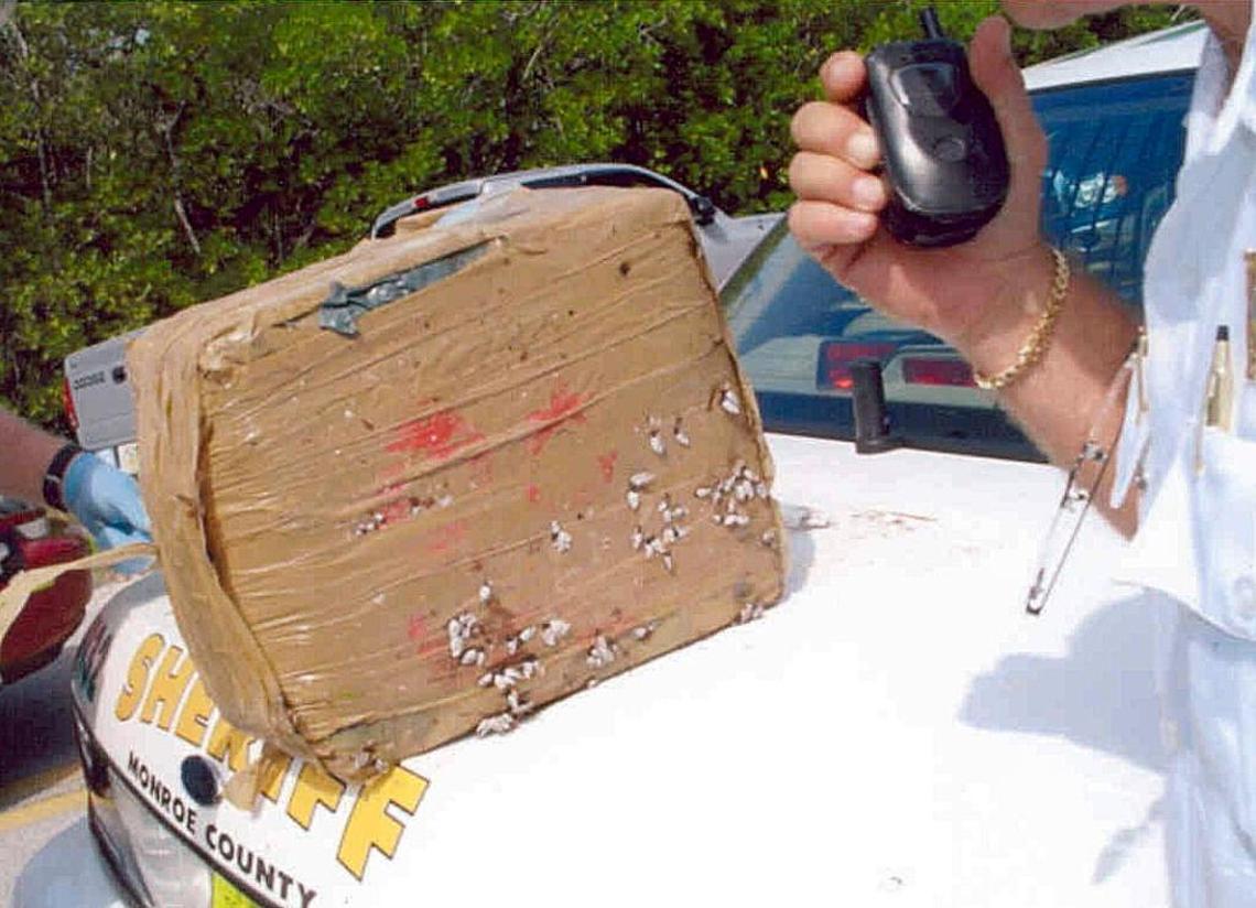 A estimated 50 pound bale of cocaine rests atop the trunk of a Monroe County Sheriff’s car in this Feb 7, 2004 file photo. The drugs were found under a tree on Boca Chica Beach, just outside Key West