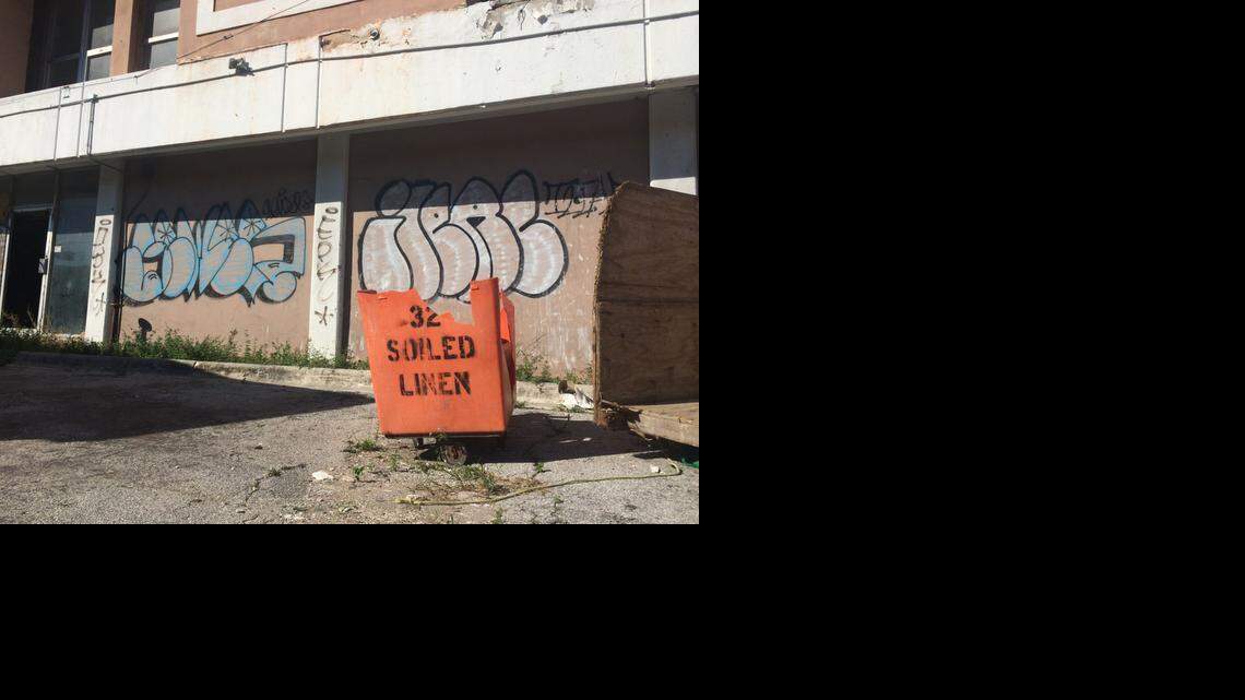 
A broken soiled linen bucket sits in front of the graffiti-covered hotel named The City Inn, 679 NW 79th St., just off Interstate 95. The hotel, which was once a Holiday Inn, has sat vacant for years.

