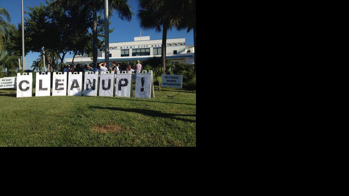 
Neighbors upset with Miami’s plan to remediate contaminated soil at Merrie Christmas Park gather outside City Hall before a public hearing on the city’s clean-up efforts.
