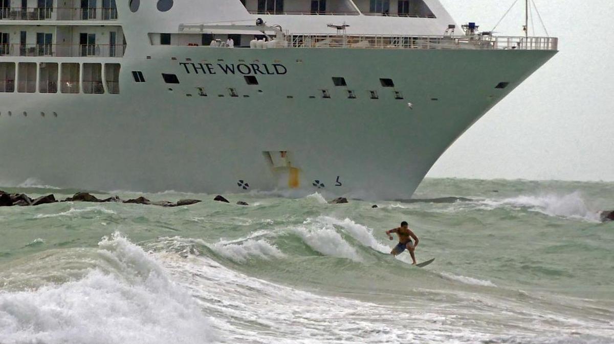 A surfer takes advantage of Miami’s blustery weather on Monday, as the cruise ship, The World arrives at the Port of Miami. Wind gusts ranged from 20 to 30 mph Monday, and are expected to remain through Wednesday.