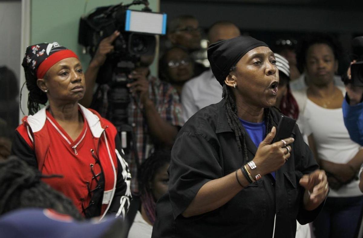 Community activist Renita Holmes speaks during a community meeting by opponents of the David Beckham soccer stadium in Overtown.