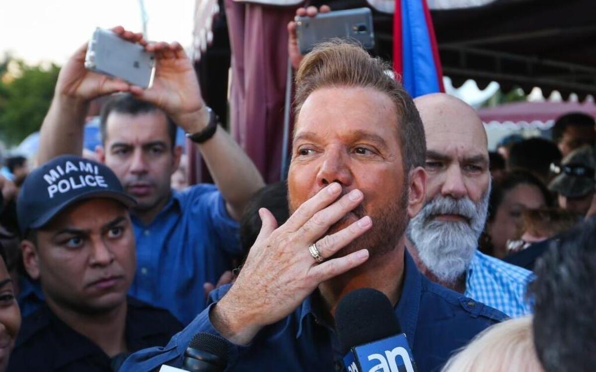 Cuban musician Willy Chirino reacts to the crowd outside of the Versailles Restaurant in Little Havana on Saturday, Nov. 26, 2016.