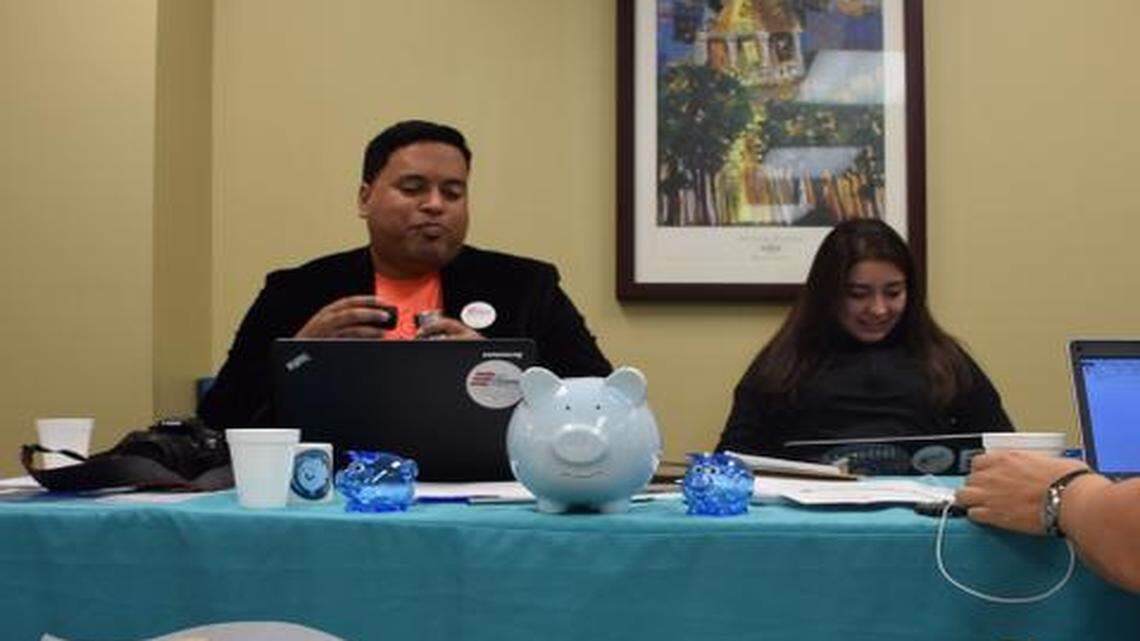 
Milton Vazquez, Florida spokesman for nonprofit organization Enroll America (left), and Denise López Martinez, an Enroll America volunteer (right), attend an Obamacare sign up event at Hialeah Hospital on Feb. 15, the end the final day of open enrollment this year. 
