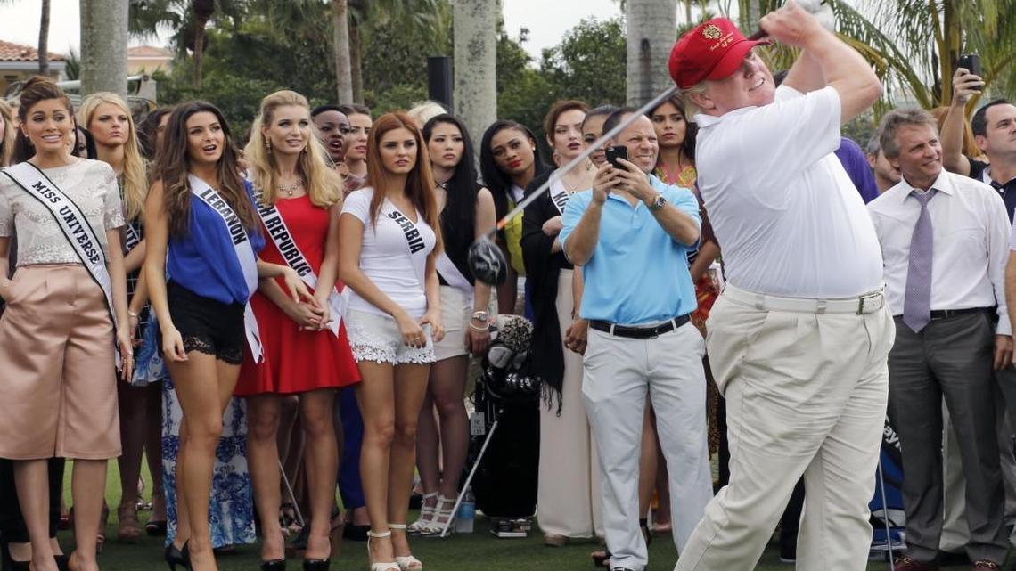 The future president-elect tees off at his Doral resort in January 2015 as contestants from the Miss Universe pageant, a television event that he used to own, watch the shot.