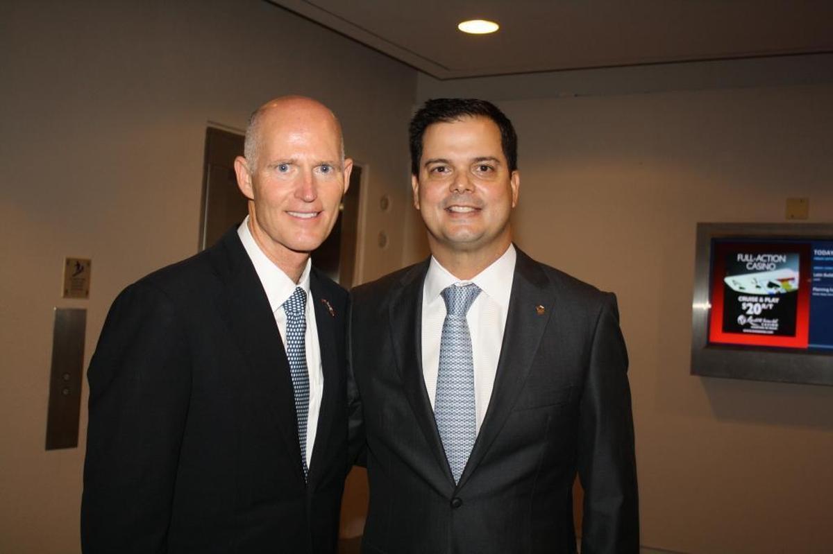 Gov. Rick Scott is pictured with Bernie Navarro, president of Benworth Capital Partners, at a Latin Builders Association event in 2013.