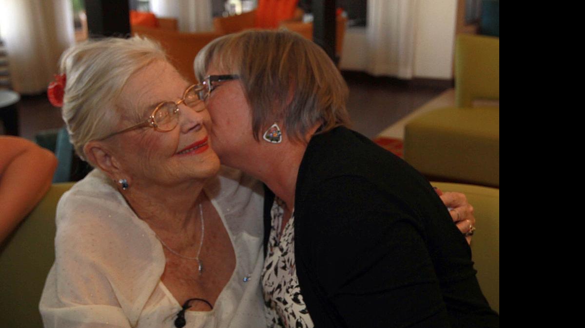 
Bererly Adams, left, gets a kiss from her daughter Becky Chechak, on Thursday, May 14, 2015, at their reunion in Miami.
