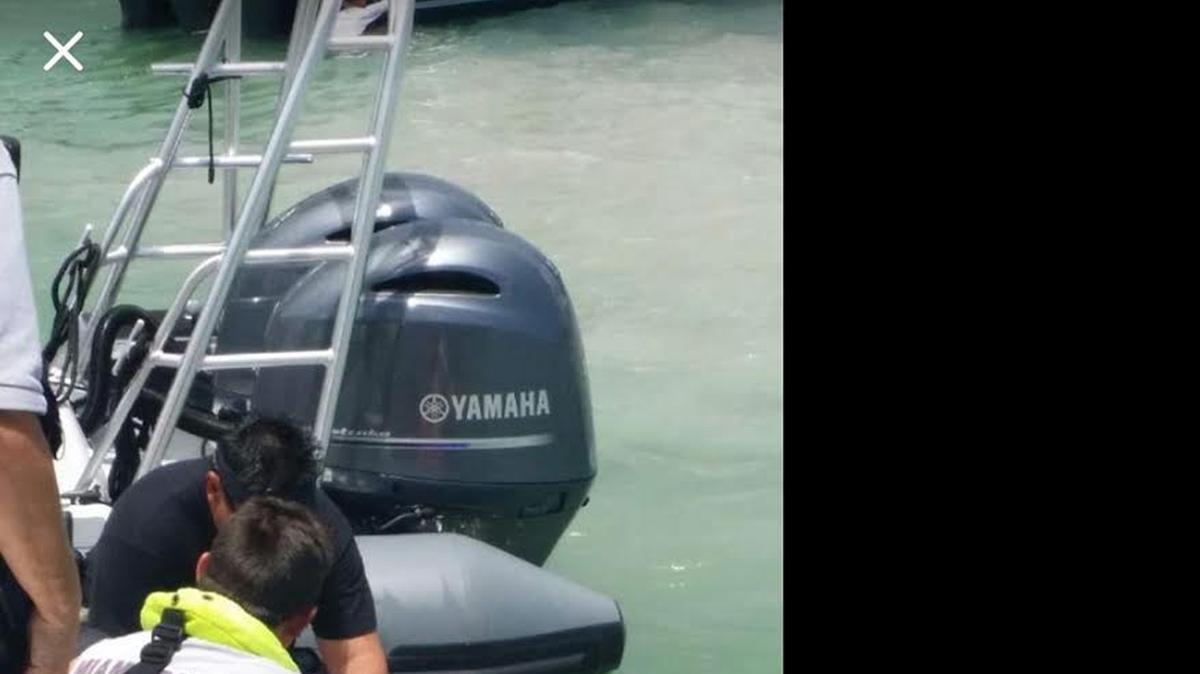 
WATER RESCUE: Miami-Dade Fire Rescue paramedics prepare a woman for transport after she dove head first off of a boat into the shallow waters of Nixon’s Beach on Key Biscayne.,
