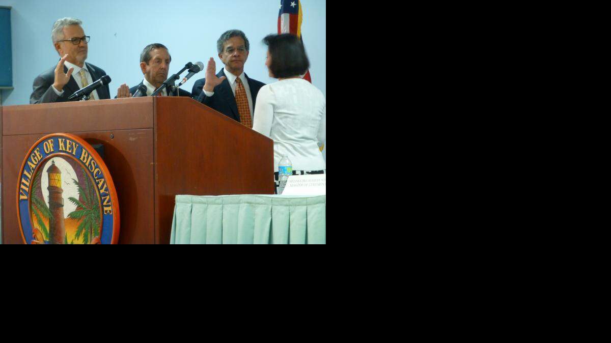 
Key Biscayne Council members Luis Felipe de la Cruz, James Taintor and Franklin Caplan are sworn in by Miami-Dade Circuit Court Judge Dava J. Tunis.
