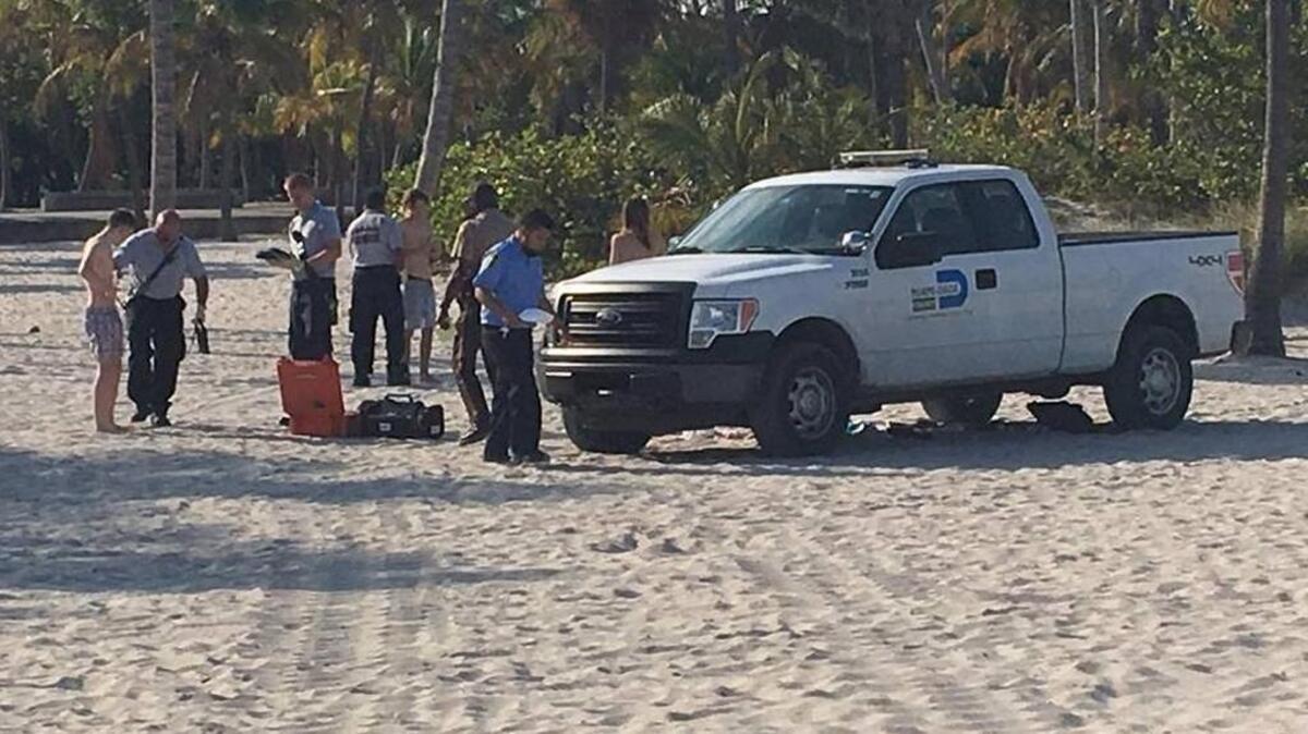 A Miami-Dade County Parks and Recreation officer ran over three Crandon Park beachgoers with his county truck as they lay on the sand Friday evening, police said.