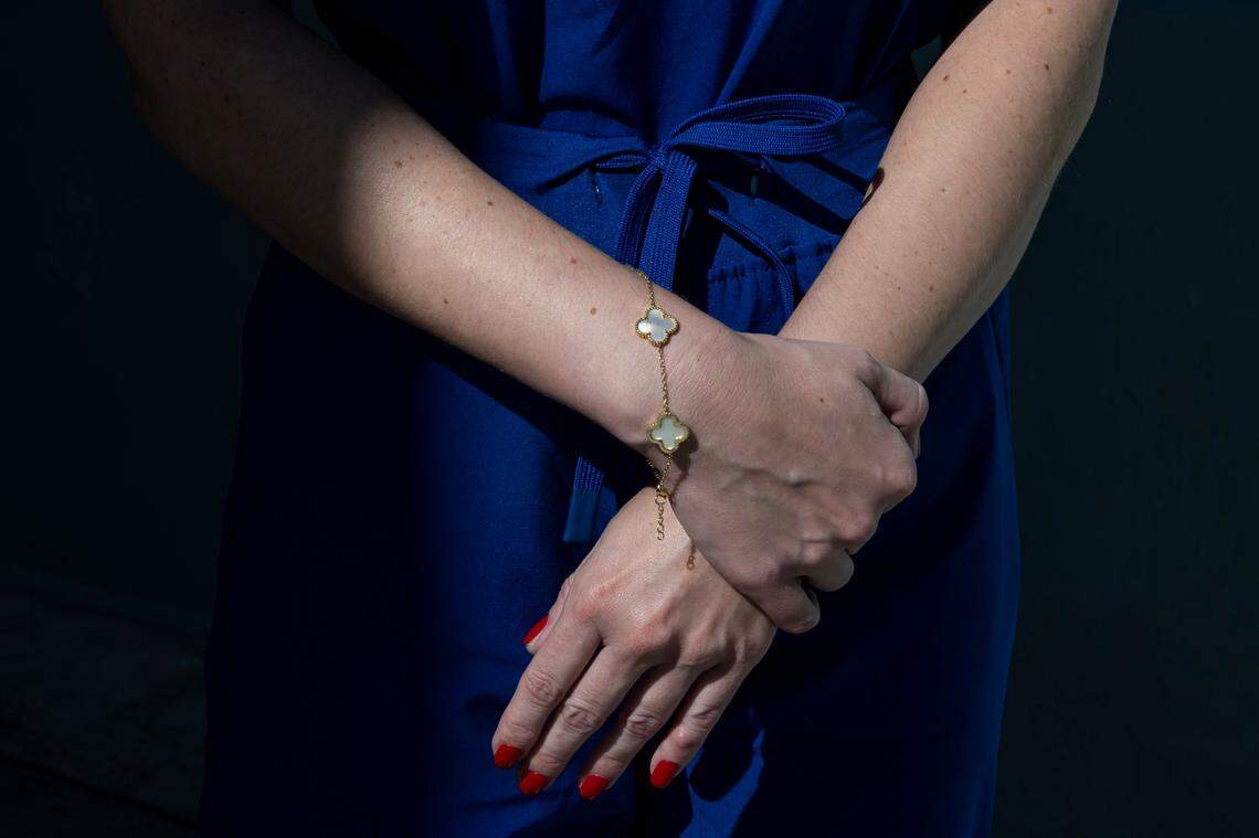 Maria S., 38, who alleges she was raped by Oren Alexander during a private party at the Versace Mansion in 2014, stands outside of the Miami Beach Police Department on Thursday, Dec. 19, 2024, in Miami Beach, Fla. Maria reported the assault to police on Thursday.