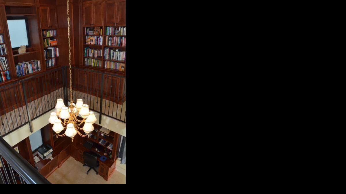 
A custom-designed library and office area conceptualized by homeowner Cristina Sammataro is shown inside her pink mansion off Harbor Drive in 2013.
