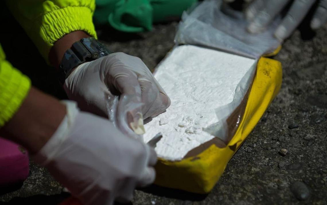 Members of the Colombian anti-narcotics police force test cocaine, part of a one-ton shipment seized in Buenaventura, the nation’s main Pacific port.