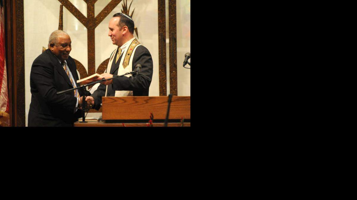
Rev. Dr. Bernard LaFayette Jr. receives a welcome from Rabbi Alan Litwak during an Interfaith Shabbat service honoring Martin Luther King Jr. at Temple Sinai on Friday, Jan. 16, 2015.
