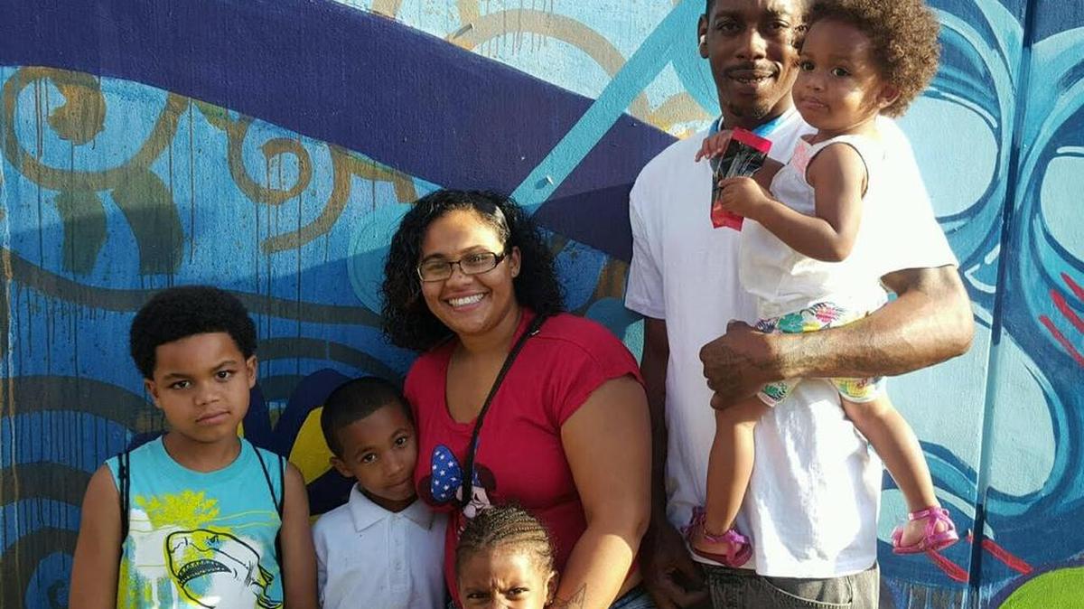 Suneliz Santana, 26, and Vincent Scott, 28, and their four children.