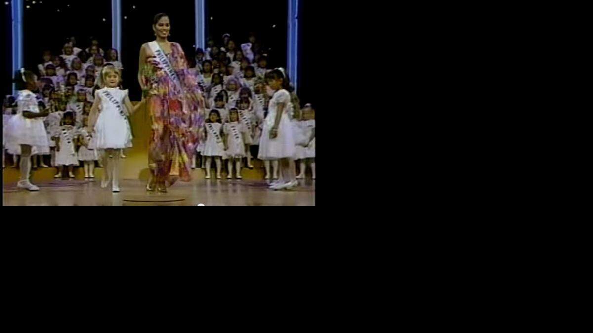 
Jennifer Weiselberg, 7, walks down the aisle with Miss Philippines Desiree Verdadero at the 1984 Miss Universe Pageant in Miami.
