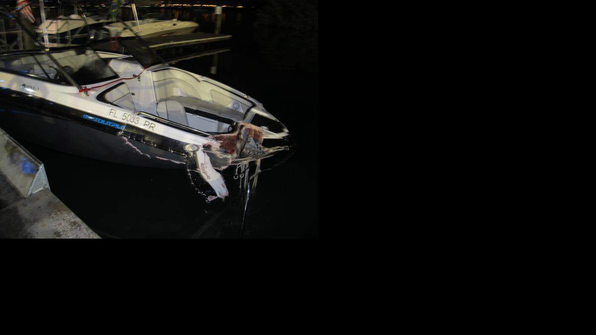 
A damaged boat that was hit during a hit and run crash on Biscayne Bay is shown Sunday, Jan. 4, 2015.
