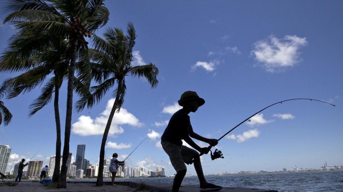 Edgar Delamont, 6, of Miami fishes from the Rickenbacker Causeway in Key Biscayne on a picture-perfect Sunday during Labor Day Weekend.