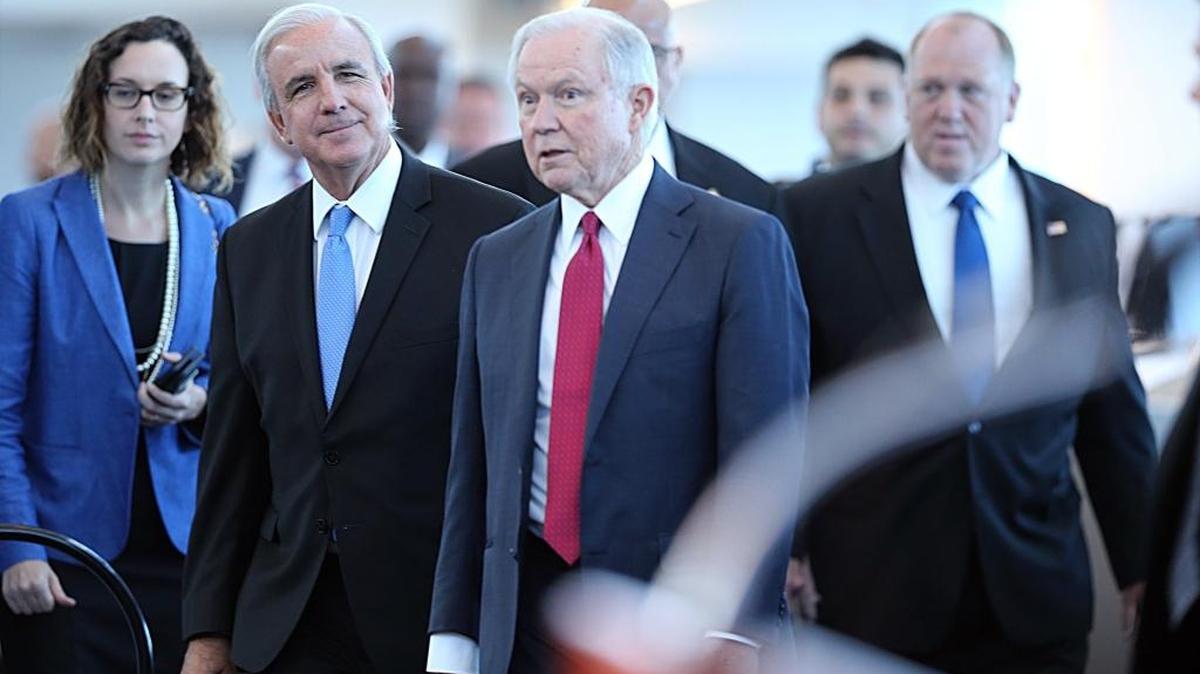 Miami Dade County Mayor Carlos Gimenez (second from left), joined U.S. Attorney General Jeff Sessions and Immigration and Customs Enforcement acting director Tom Homan as they arrived at Port Miami for an Aug. 16, 2017, speech by Sessions. During the talk, Sessions promised Miami-Dade more money for crime fighting in exchange for the county’s cooperation on immigration detentions, but Miami-Dade hasn’t seen a windfall yet.