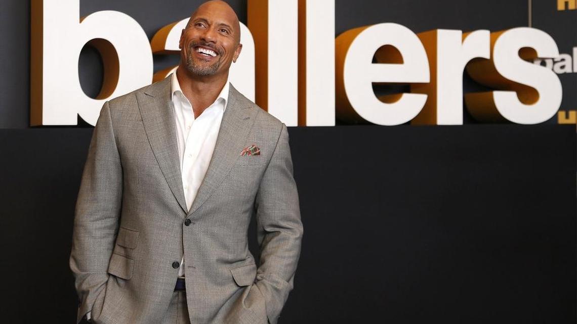 Dwayne “the Rock” Johnson poses for pictures on the premiere night of the second season of HBO’s “Ballers” on July 14, 2016. The party was held at the New World Symphony in Miami Beach. “Ballers” later moved to California.