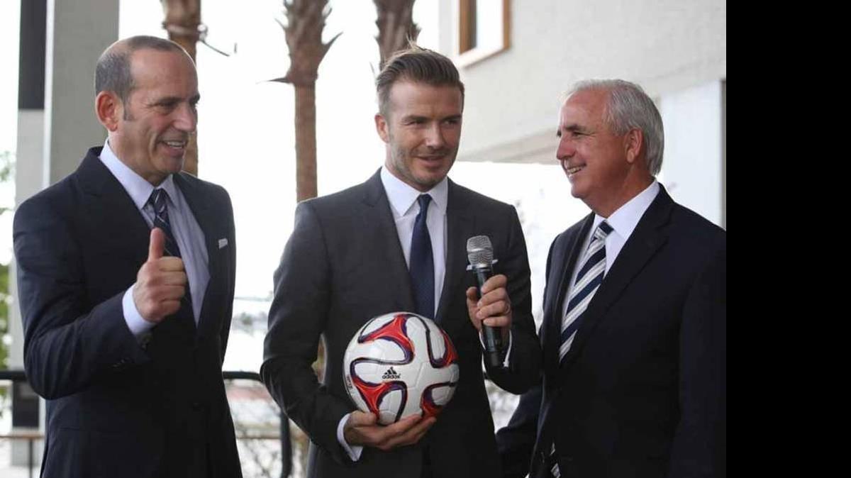 
David Beckham, center, with MLS commissioner Don Garber, left, and Miami-Dade Mayor Carlos Gimenez, right. Beckham and his partners will begin negotiating with the city of Miami to build a stadium in Little Havana, across from Marlins Park.
