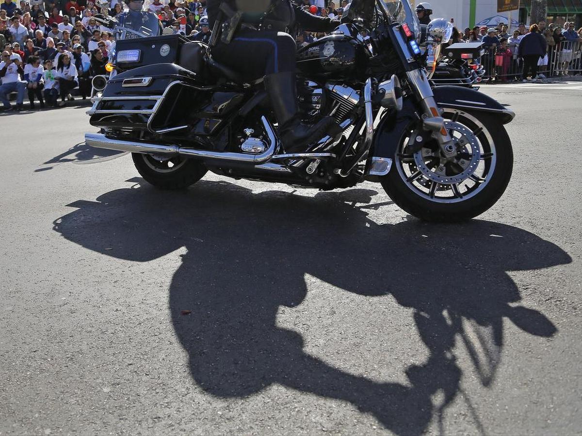 A Doral Police motorcade makes its way down Southwest 8th Street during the annual Three Kings Day Parade in Little Havana on Sunday, Jan. 8, 2016.